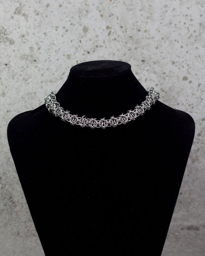 COLLIER « ÉTREINTE D’ACIER » 1/1