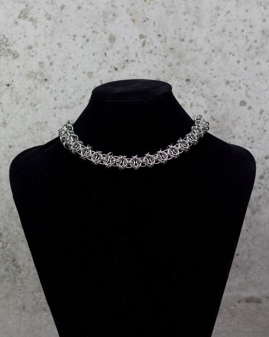 COLLIER « ÉTREINTE D’ACIER » 1/1